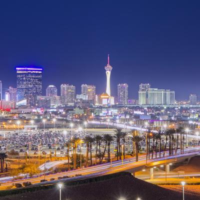 A view of the Las Vegas skyline as seen from Harry Reid Airport at night.