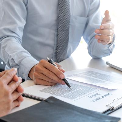 An insurance agent explaining a policy to a customer.