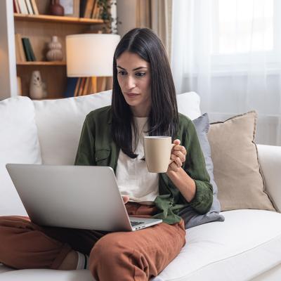 A person checking through her earnings from an online business in a laptop.