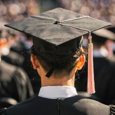 A back view of a university graduate during their ceremony.