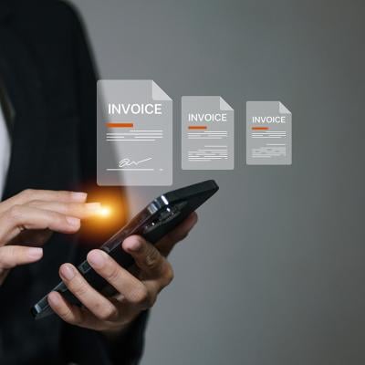 A business manager signing digital invoice documents from her smartphone.
