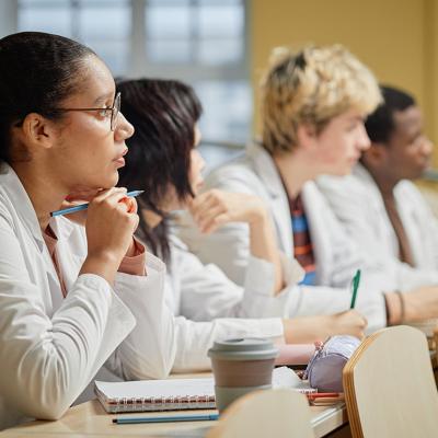 Medical students listening to a lecture at a university.
