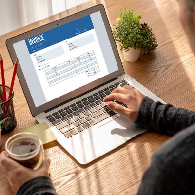 A finance professional working on an invoice.