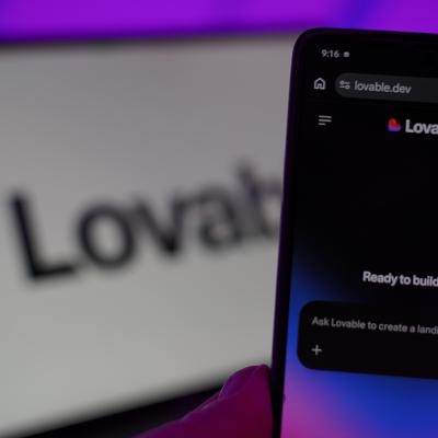 The Lovable AI app with a background of their logo.
