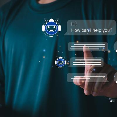A person utilizing an AI chatbot that responds to online messages or inquiries.