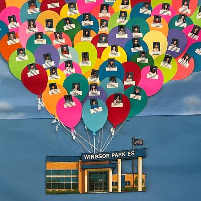 Windsor Park Elementary students are pictured on the school’s Millionaires Club display, which recognizes children who read at least one million words during the school year.