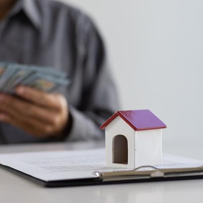 A real estate agent counting cash payment after closing a deal.