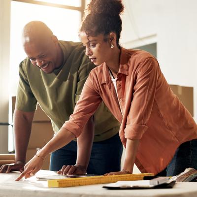 A couple reviewing renovation plans for their home.