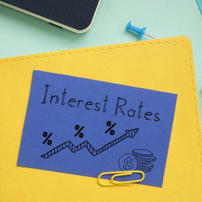 A notebook labeled with interest rates and an illustration. 
