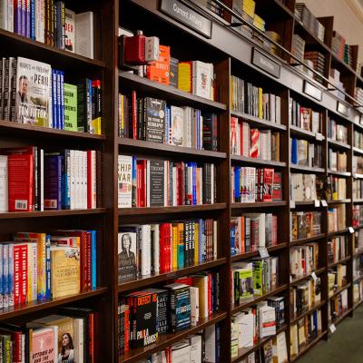 Books displayed for sale on shelves at Barnes & Noble bookstore in New York City, USA.