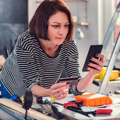 A person shopping for additional construction materials online after a kitchen renovation.