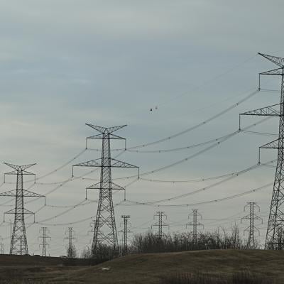 Electric poles and power lines seen in South-East area of Edmonton, Alberta, Canada.