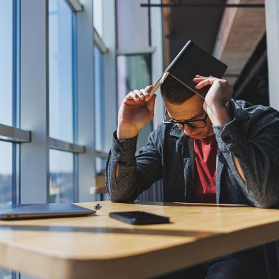 A stressed out businessman during his break in an office.
