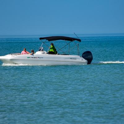 People enjoying bowrider boat ride in the Clearwater Beach in Florida, USA.