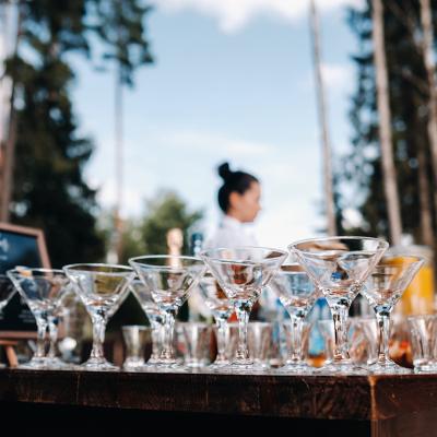 Empty martini glasses on an open bar.