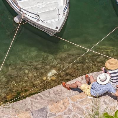 A senior couple relaxing by the lagoon.