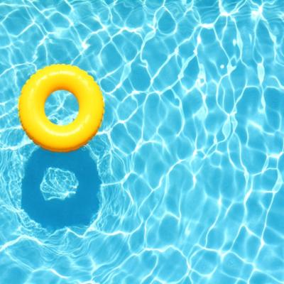 A yellow pool float in a pool.