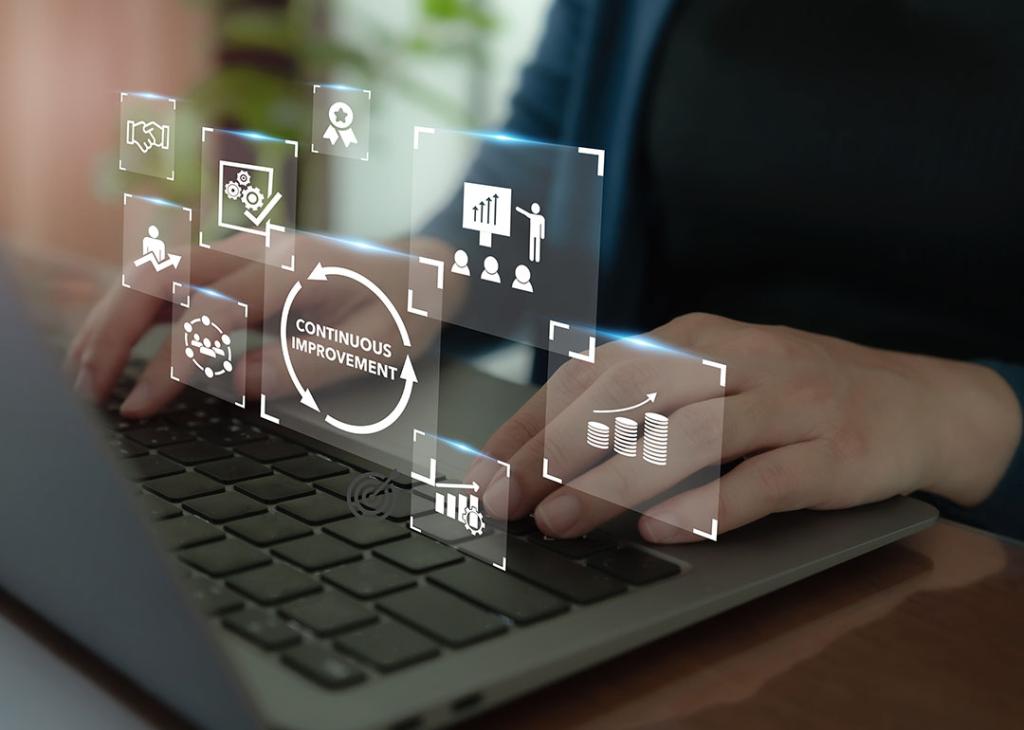 Continuous improvement concept illustrated by data icons superimposed over person typing on keyboard.