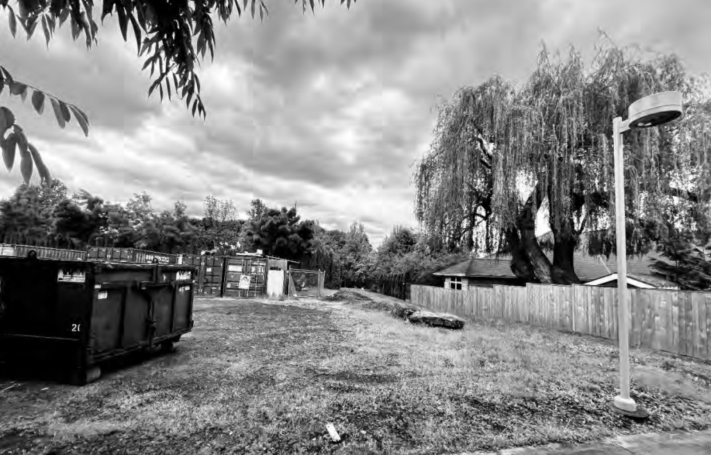Black-and-white photo of an empty lot in 2022 where the Hepburn house used to be.