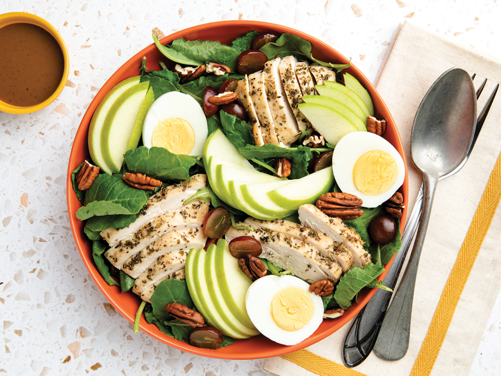 Kale salad with herb-roasted chicken.