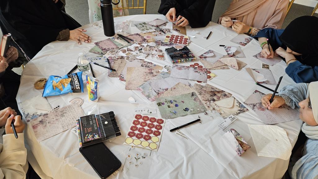 Women and girls write and decorate reflective letters to their past or future selves at a self-care event at the Muslim American Society Youth Center in Brooklyn, New York, on July 25.   