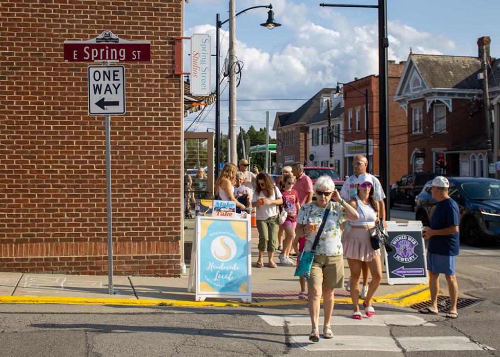 People crossing the pedestrian lane at Spring Street in Zelienople.