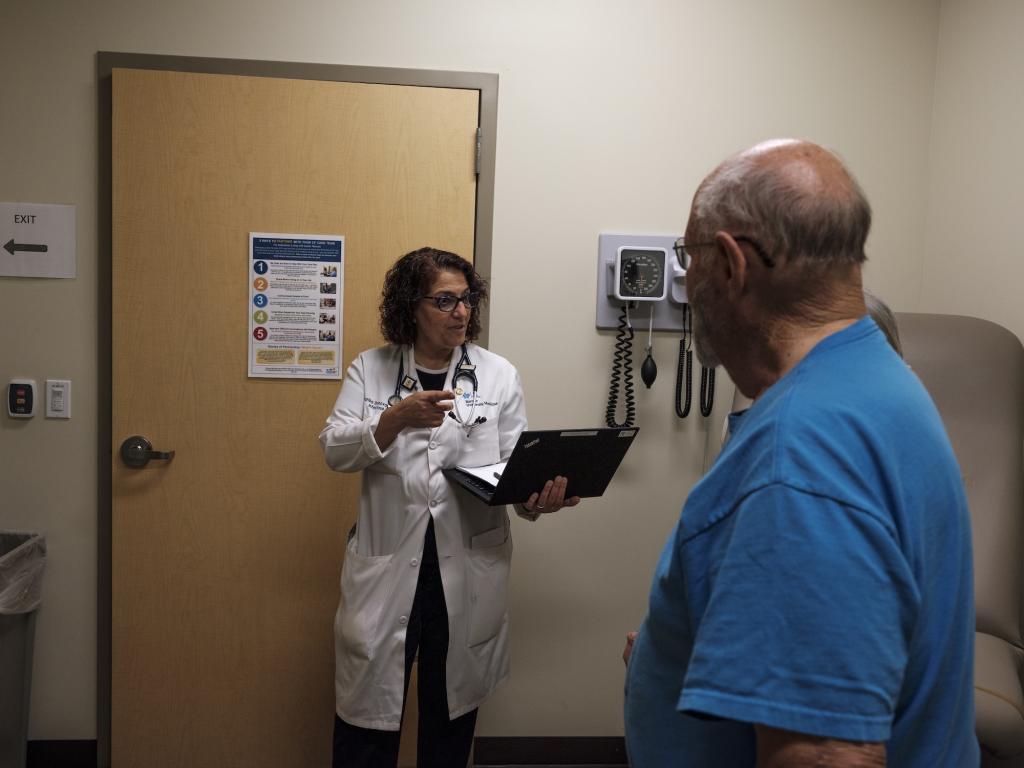 Dr. Fariba Donovan talks to patients at the Valley Fever Center at Banner University Medical Center North in Tucson, Arizona.