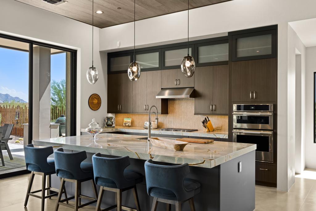 Interior of a modern home kitchen with flat-panel cabinets and vanities.