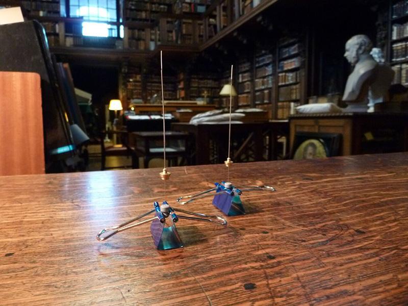 Delicate instruments that look like vertical wires held up by binder clips on a wooden table sample the air wafting through the library of St. Paul’s Cathedral in London, picking up volatile compounds that evoke the collection’s distinctive scent of old books and furniture.