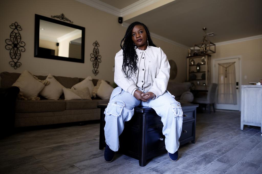 Ashley Gaignard poses for a photo inside her home in Donaldsonville, La., less than three miles from the world’s largest ammonia plant.