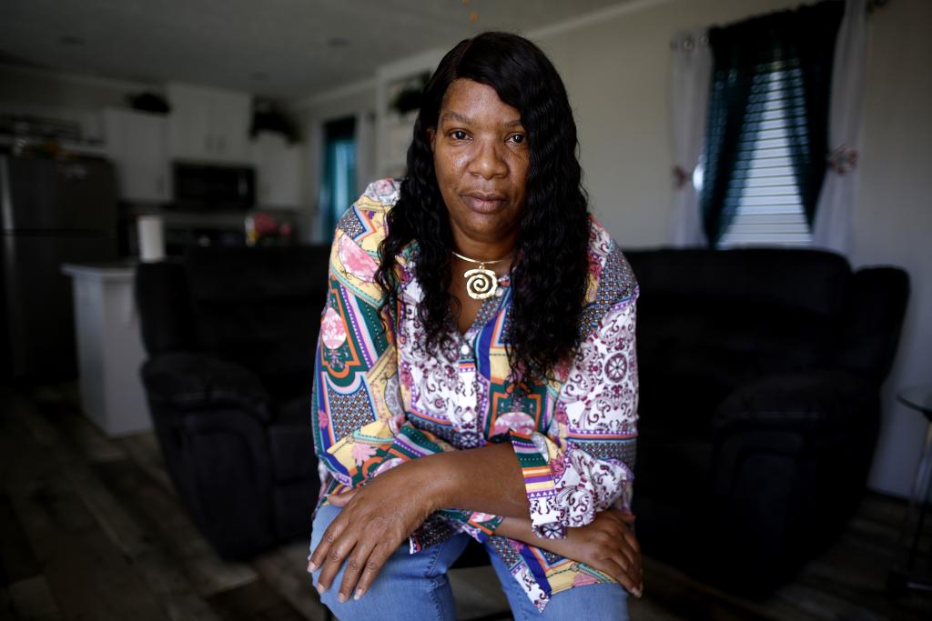 Twila Collins poses for a photo inside her home in Modeste, a small Louisiana community next to the Mississippi River. She’s concerned about the potential health and safety dangers of a proposed CF Industries blue ammonia plant.