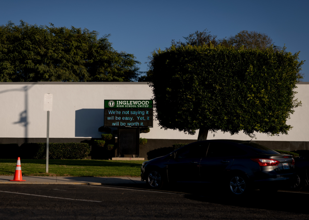 A sign on an electronic message board outside Inglewood High School 'United' that reads "We're not saying it will be easy. Yet, it will be worth it."