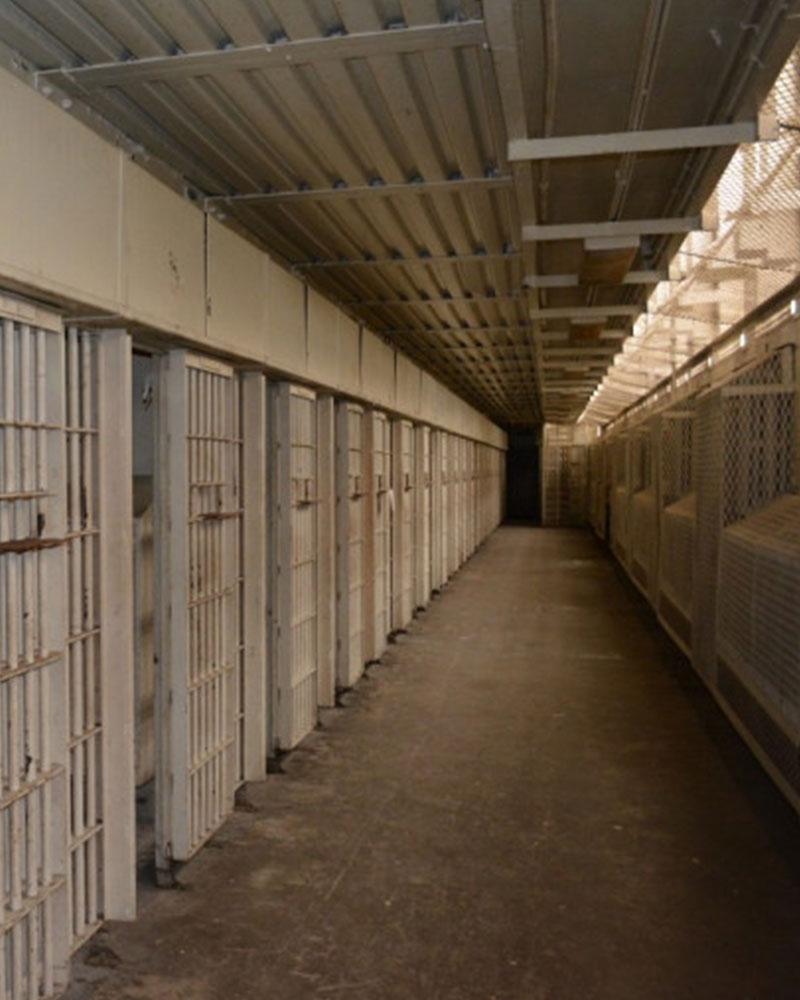 A portion of the former maximum-security prison unit at Lorton Reformatory remains intact, with cell blocks preserved. 