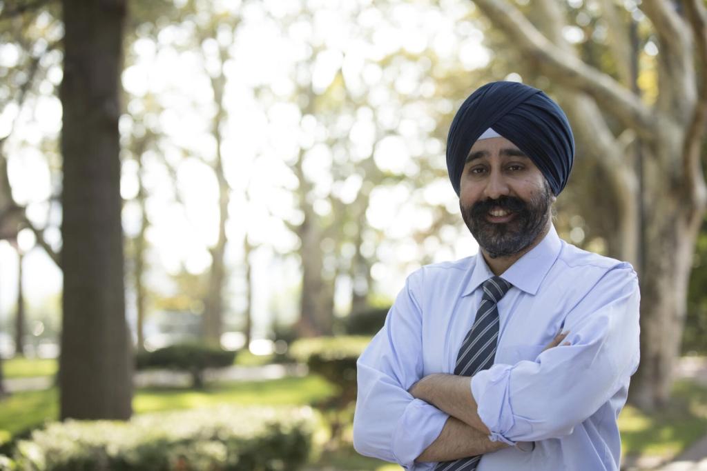 Mayor Ravi Bhalla wearing a tie and blue shirt and a navy blue turban.