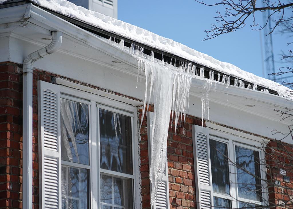 Icicles built up in a roof gutter.