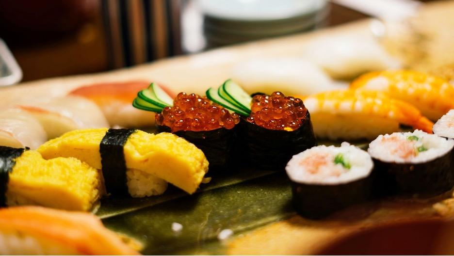 A plate of assorted sushi.