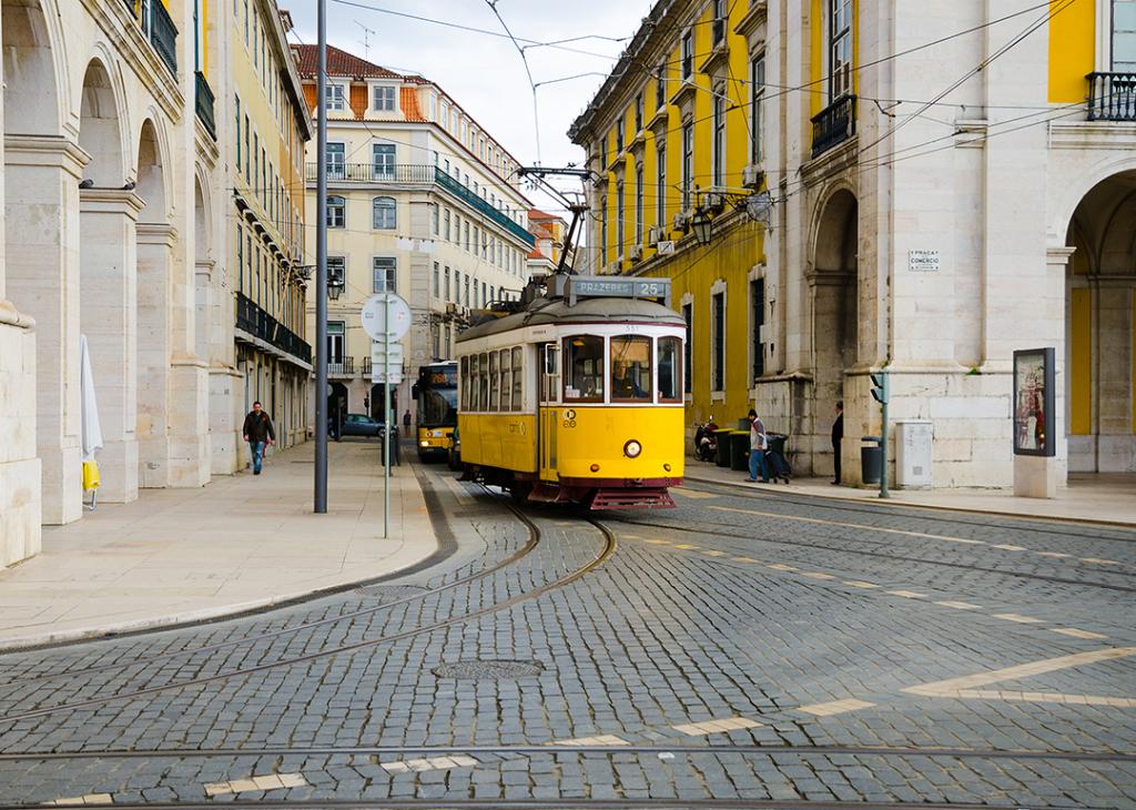An old tram at Praça do Comércio in Lisbon, Portugal.