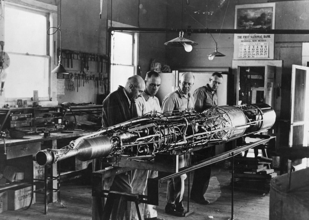 Rocket with turbopumps that inject propellants into the combustion chamber on its assembly frame is shown without its casing at the Goddard shop in Roswell, New Mexico