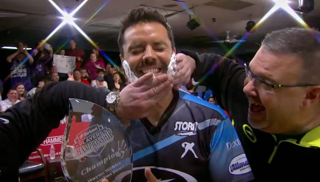 A bowler who won a championship getting shaving cream spread on his face in celebration