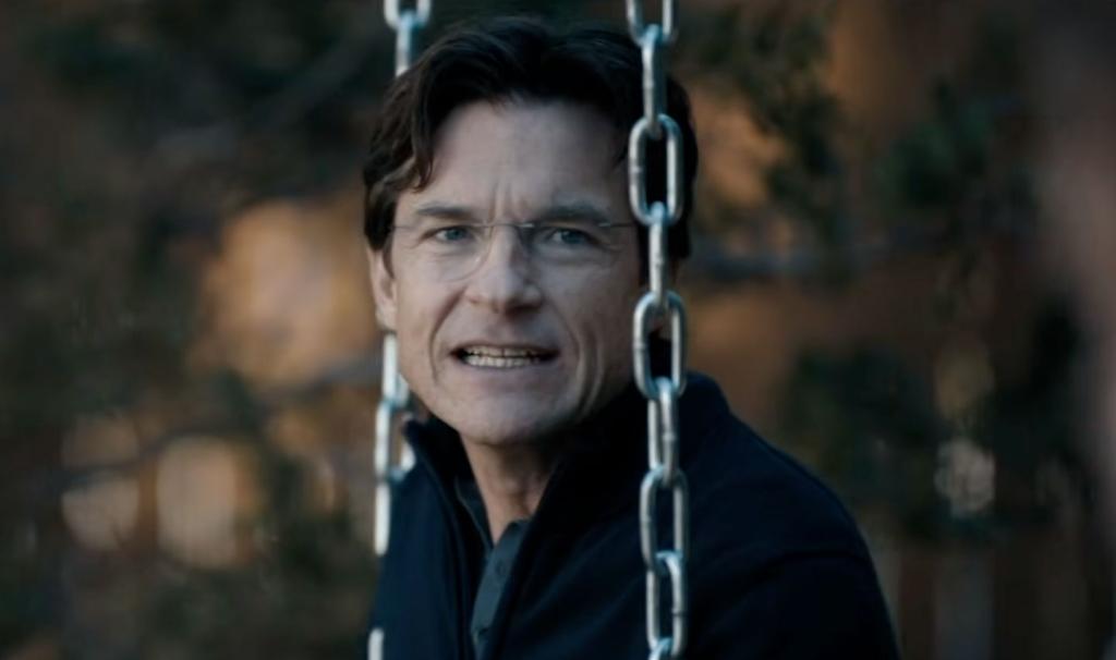 Jason Bateman sitting on a swing in DTF St. Louis