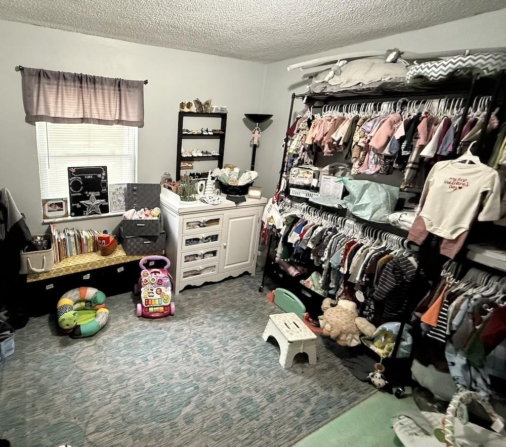 A crisis pregnancy center room where clothing, diapers, strollers, toys and other items are stored as part of the help for women through health and financial crises.