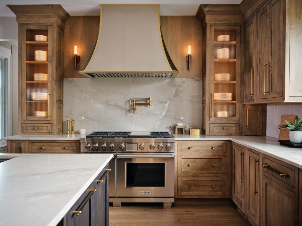 Modern luxury kitchen with interior cabinet lighting.