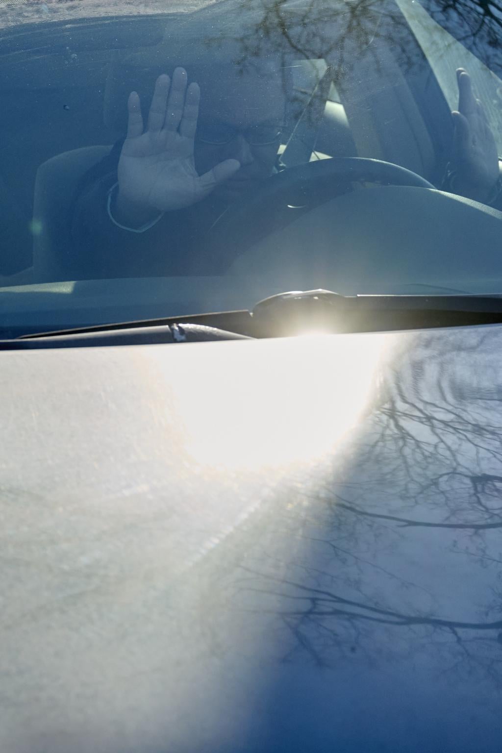 A driver raises their hands in deference to a protest passing in Minneapolis on 31 January.