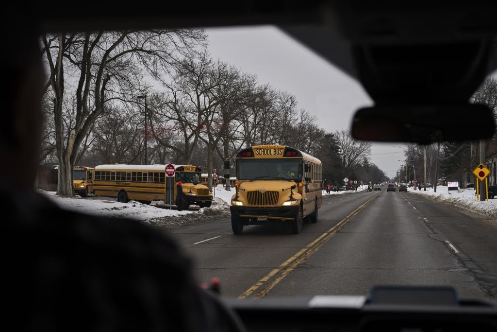View through the windshield of school district employees patroling an elementary school drop-off in Fridley, Minnesota, on 5 February.