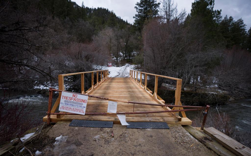 A sign and a gate block a bridge to what was once St. Ann's Retreat, Wednesday, Feb. 25, 2026.
