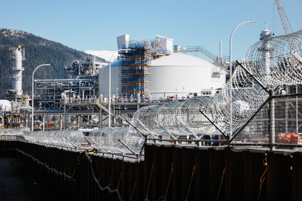 View outside the gate with concertina wire enclosing the $40-billion LNG terminal whose construction took around five years, connecting British Columbia shale gas reserves to pan-Pacific shipping routes.