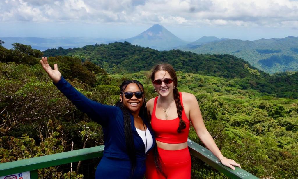 Tourists pose for a photograph at the Arenal Volcano National Park in Costa Rica.