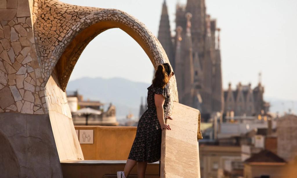 A tourist enjoying a view from the rooftop of Casa Milà (La Pedrera) in Barcelona, Spain.
