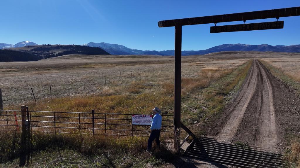 Brad Wilson stands beside the entrance to the former Sweetgrass Trail. To set foot in the mountains beyond, the 71-year-old must now hike in from the closest public access point more than 20 miles away and ascend several mountains.