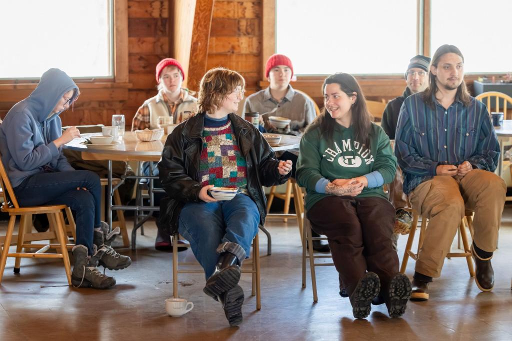 Students gather for a community meeting after lunch in the dining hall at Sterling College in Craftsbury Common, Vermont.